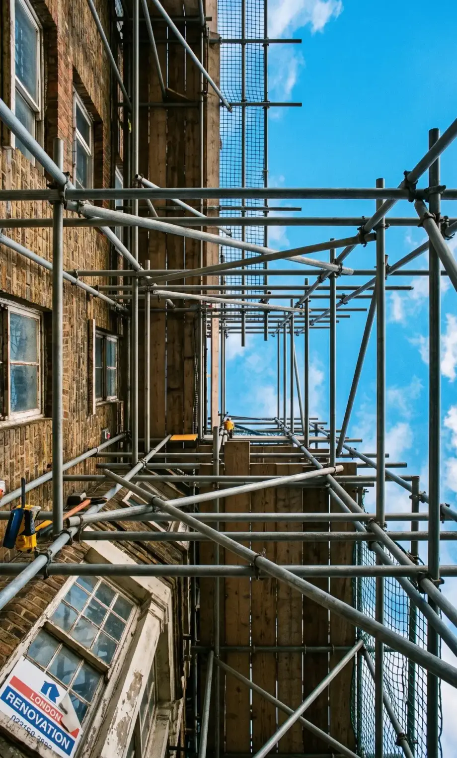 Scaffolding on a brick building during renovation